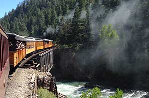 Train going over a river bridge