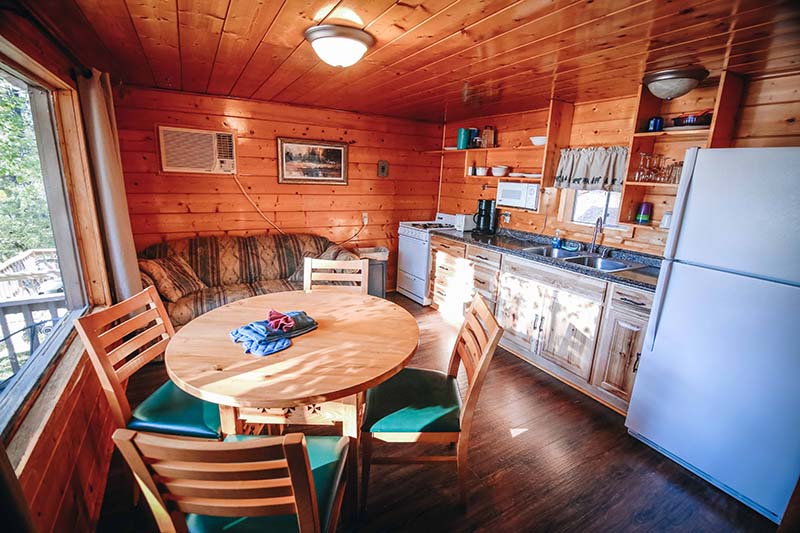 Cabin kitchen table and kitchen.