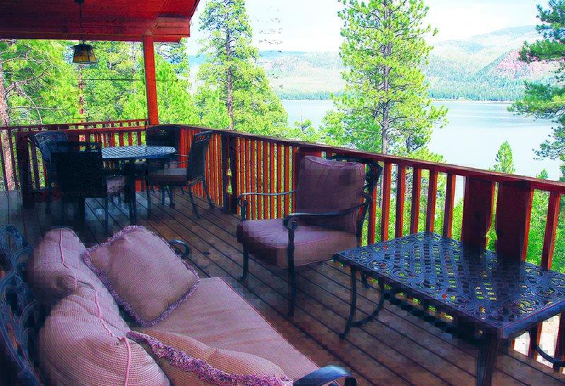 Cabin patio with lake view.