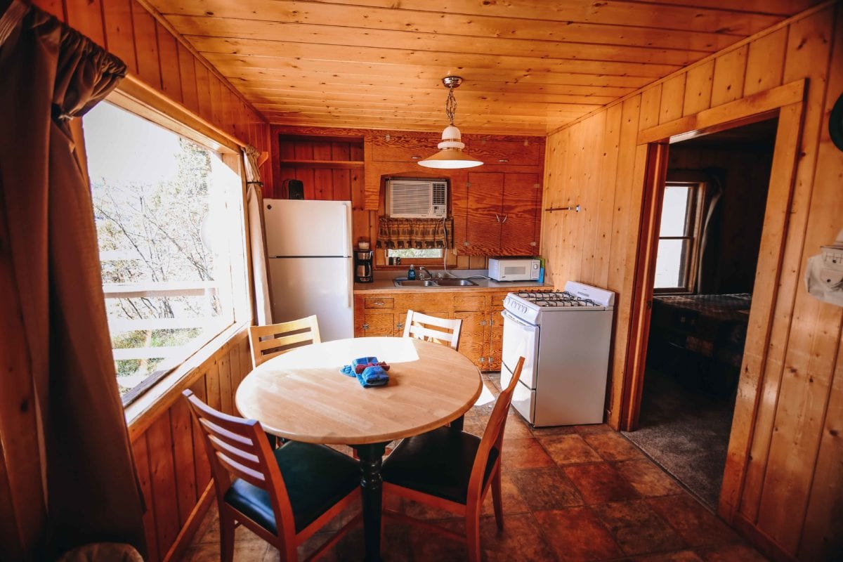 Cabin 20 dining table and kitchen.