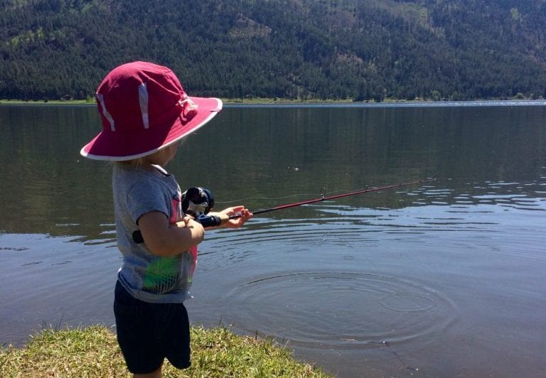 Young kid fishing on the lake.