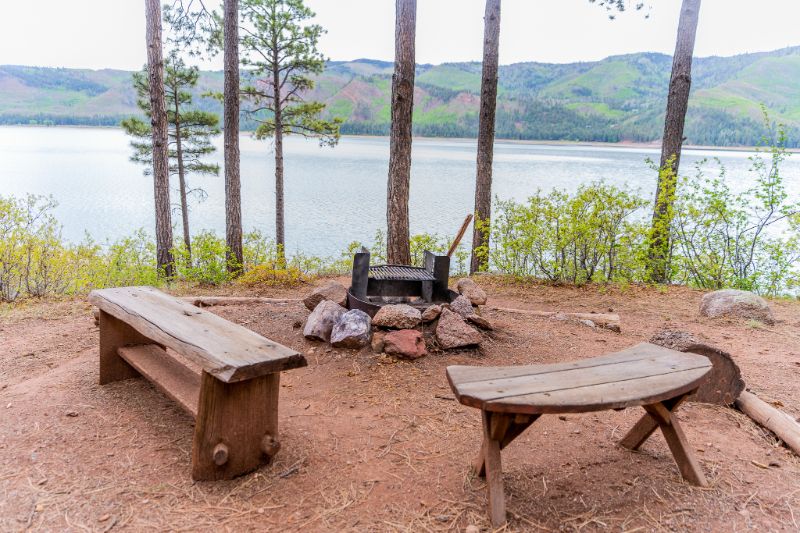 Cabin 33 lakeside fire pit and wooden benches